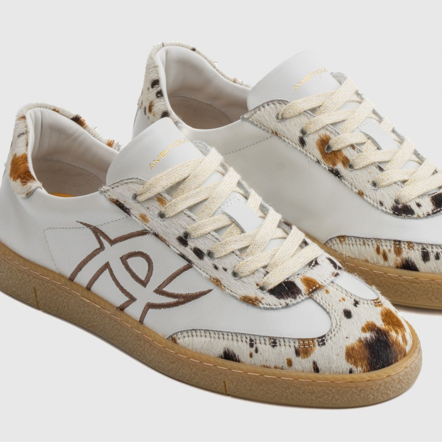 NOA sneaker in white / cow print - women
