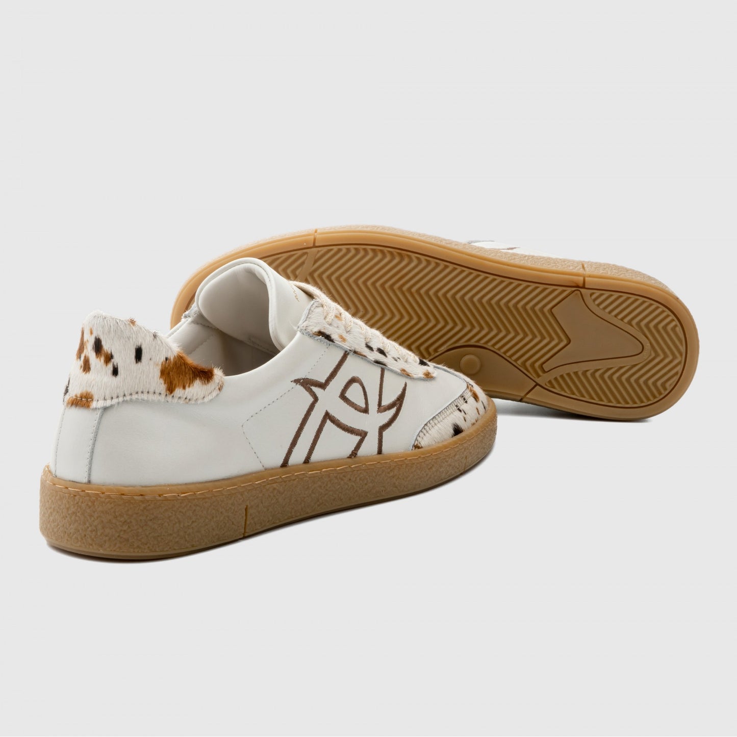 NOA sneaker in white / cow print - women