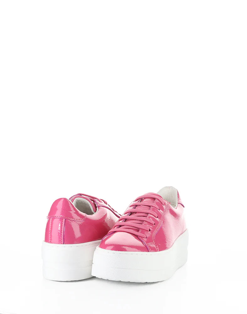 Pink sneakers with white soles on a white background
